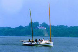 Dory boat off shore of Accokeek Foundation, in front of Mount Vernon.