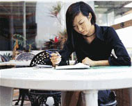 Photo of a woman working at a desk