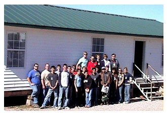 Figure 1: Students in front of an OCI-manufactured home.
