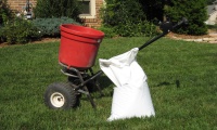 Photo of fertilizer and an applicator.