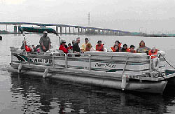 Photo of people on a riverboat; river-based recreation creates funding opportunities for the Hackensack Riverkeeper's organization.
