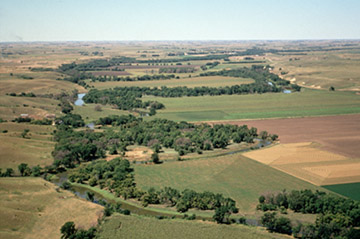 view of field and stream